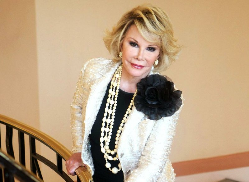 This Oct. 5, 2009 file photo shows Joan Rivers posing as she presents "Comedy Roast with Joan Rivers " during the 25th MIPCOM (International Film and Programme Market for TV, Video, Cable and Satellite) in Cannes, southeastern France. The New York City clinic where Joan Rivers suffered a fatal complication during a medical procedure is losing its federal accreditation.  The city's medical examiner found she died of brain damage due to lack of oxygen after she stopped breathing during an endoscopy days earlier. 