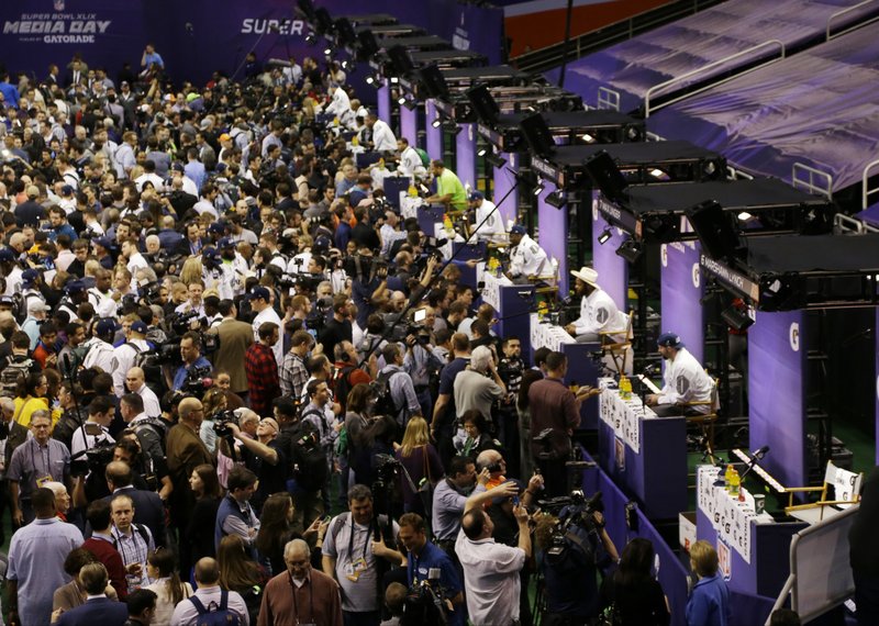 The Associated Press QUIET MAN: Seattle running back Marshawn Lynch's seat, far right, remains empty after he leaves during Super Bowl Media Day Tuesday in Phoenix. Saying he appeared only to avoid incurring a fine from the National Football League, Lynch left after about 2 minutes, 30 seconds of a scheduled one-hour session.