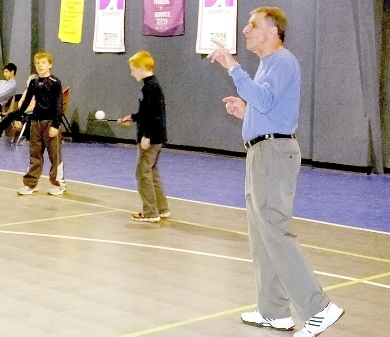 Lynn Atkins/The Weekly Vista Helmet Sperl has some advice for the young pickle ball players at the Boys and Girls Club last week. The older players are helping the kids learn the game and in return, they use the gym for their own games three times a week.