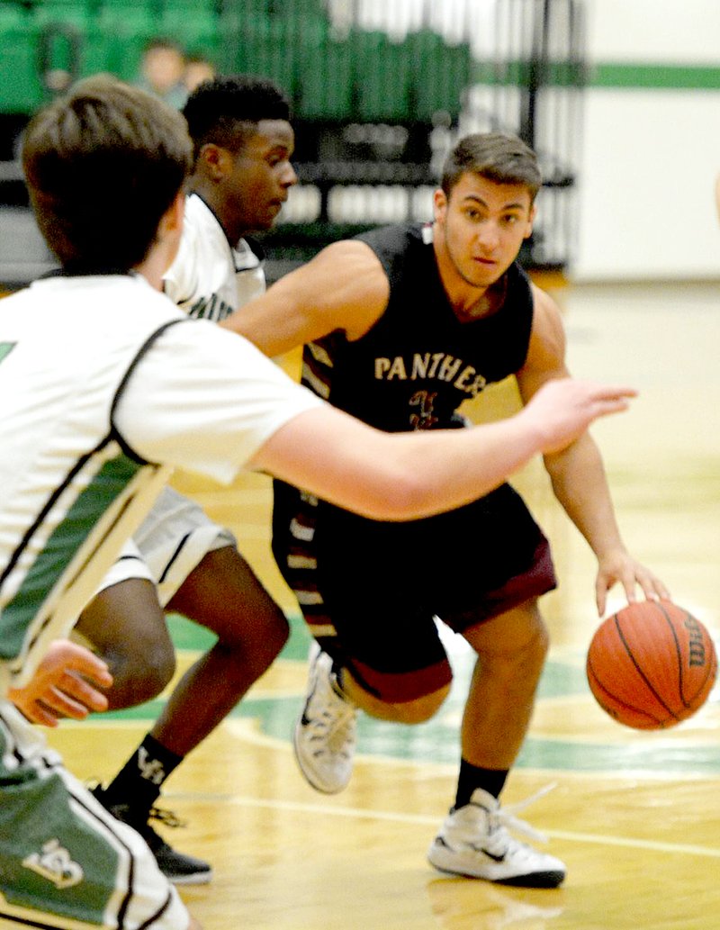 Bud Sullins/Special to the Herald-Leader Roman Lambert dribbles through the Van Buren defense in a game played on Jan. 20 at Clair Bates Arena in Van Buren.