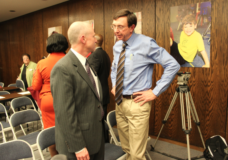 State Board of Education chair Sam Ledbetter, right, speaks to Little Rock School Board President Greg Adams shortly after the state board voted to take over the Little Rock district and dissolve the local school board. Ledbetter was the deciding vote.