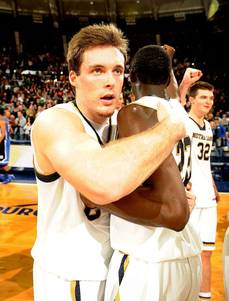 Notre Dame’s Pat Connaughton (left) hugs teammate Jerian Grant after the Fighting Irish’s victory over Duke on Wednesday night.