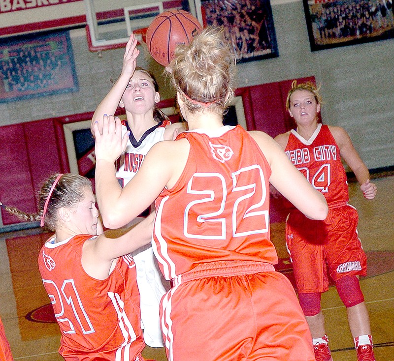 RICK PECK MCDONALD COUNTY PRESS McDonald County&#8217;s Coley Ickes gets fouled by Webb City&#8217;s Desirea Buerge (21) white attempting a layup during the Lady Mustangs 45-44 loss Tuesday night at MCHS.