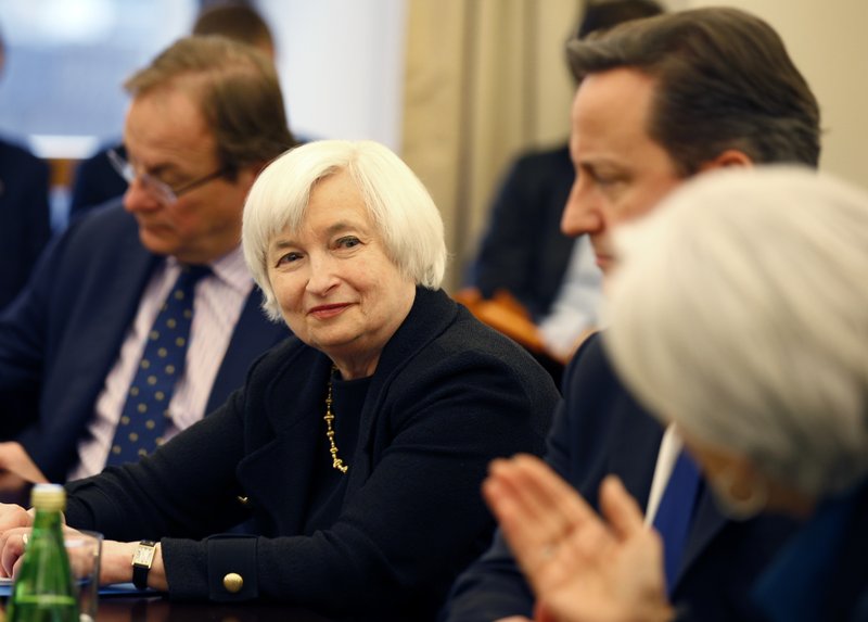 In this Jan. 15, 2015, file photo, Federal Reserve Chair Janet Yellen, left, is acknowledged by International Monetary Fund (IMF) Managing Director Christine Lagarde, right, with British Prime Minister David Cameron, during a roundtable meeting at the IMF in Washington. Federal Reserve policymakers meet to set interest rates on Wednesday, Jan. 28, 2015. 