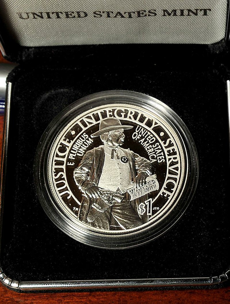 Thousands of new U.S. Marshals Service commemorative coins arrived Thursday morning in Fort Smith, where proceeds from their sale will help build a $50 million U.S. Marshals Museum.