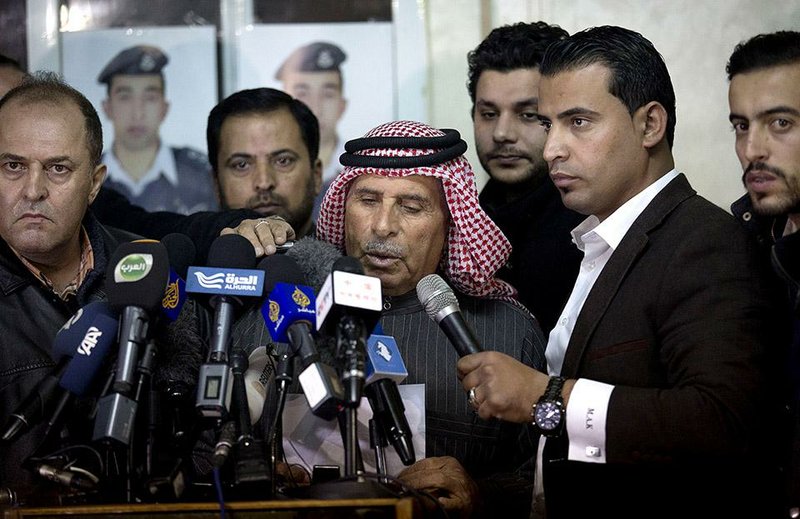 Safi al-Kaseasbeh (center), father of Jordanian pilot Lt. Muath al-Kaseasbeh, urges Thursday in Amman, Jordan, that his son’s captors have mercy on a fellow Muslim and spare his son’s life. 