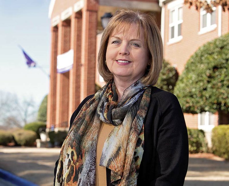 Jan Newcomer stands in front of Buffalo Alumni Hall at the University of Central Arkansas in Conway. Newcomer retired in December after almost 14 years as UCA’s director of alumni services. “I felt like it was time they got some new blood — bring in some new energy,” she said. Fayetteville native Jesse Thill, who worked for the alumni association at the University of Florida at Gainesville, is scheduled to take over the position Feb. 9. “If he comes in and brings just half of what he’s learned in his experience, it will be a true asset for UCA alums,” Newcomer said.