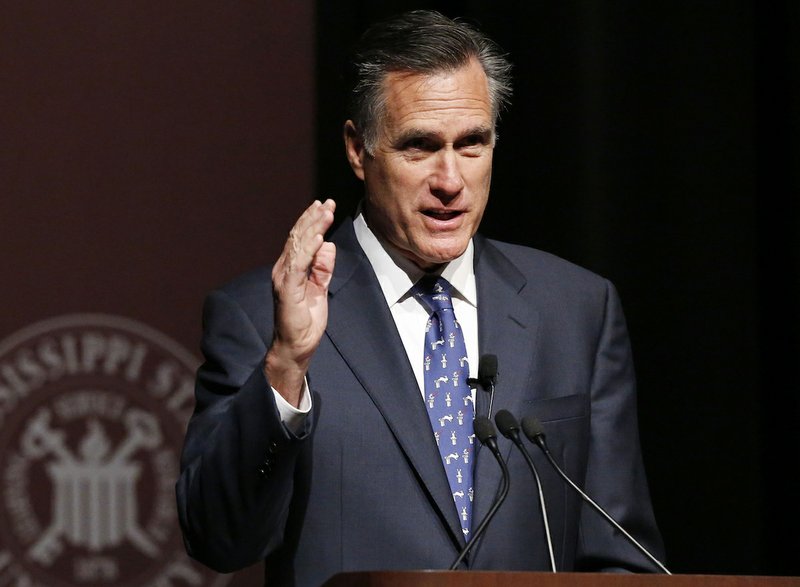 FILE - In this Jan. 28, 2015 file photo, former GOP presidential candidate Mitt Romney speaks at Mississippi State University in Starkville, Miss.