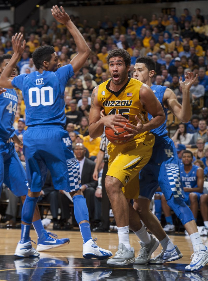 Missouri's Keanau Post (center) pulls down a rebound between Kentucky's Marcus Lee, left, and Devin Booker during the first half of Thursday’s game in Columbia, Mo.