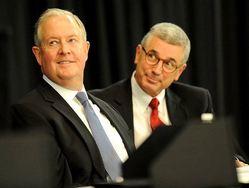 Dennis Leatherby (left), Tyson Foods’ chief financial officer, and Tyson Chief Executive Officer Donnie Smith announced a first-quarter profit of $310 million at the company’s shareholders meeting Friday. 