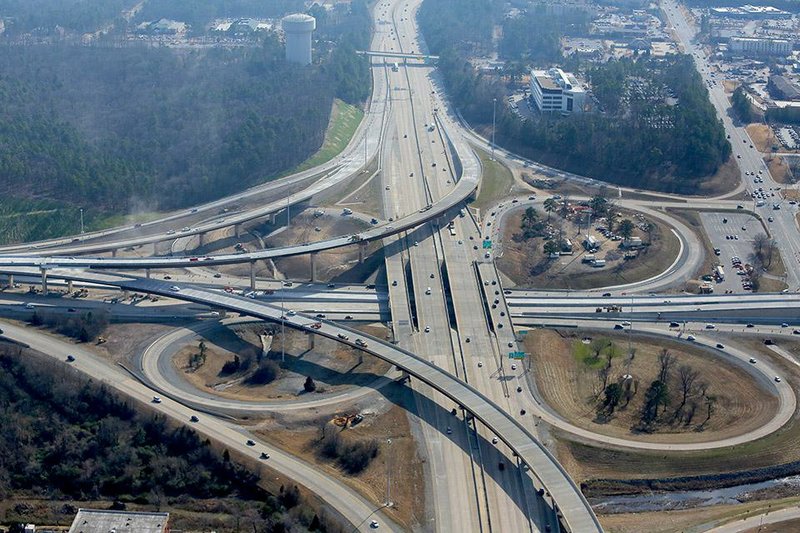 Work continues Friday on the Big Rock interchange at Interstate 430 and Interstate 630 in Little Rock, seen here from the north. The work is to be completed this summer, but highway officials plan to open a section now. 