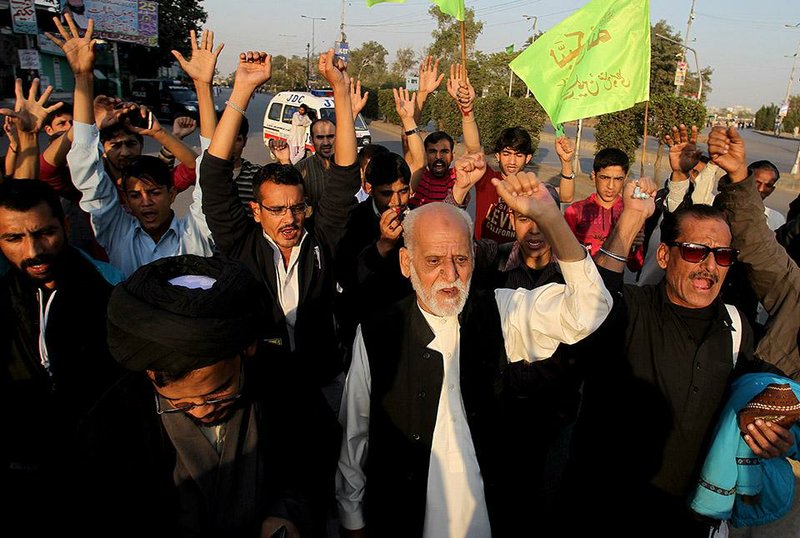 Pakistanis in Karachi protest in regard to a bombing that targeted worshippers Friday at a Shiite mosque. 