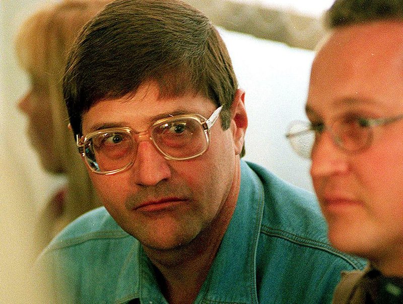 Eugene de Kock, the head of a covert police unit, who was sentenced in 1996 to two life terms plus 212 years for the deaths of dozens of people, attends an amnesty hearing in 1998. 