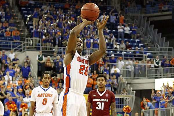 Florida guard Michael Frazier II (20) makes a free throw to tie the game with 1.9 seconds left in the second half of an NCAA college basketball game against Alabam at the Stephen C. O'Connell Center, Saturday, Jan. 31, 2015, in Gainesville, Fla. Frazier made the second free throw to give the Gators a one-point lead. Florida beat Arkansas 57-56. (AP Photo/The Gainesville Sun, Matt Stamey)