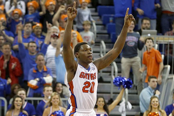 Florida guard Michael Frazier II (20) celebrates after their 57-56 win over Arkansas in an NCAA college basketball game at the Stephen C. O'Connell Center, Saturday, Jan. 31, 2015, in Gainesville, Fla. (AP Photo/The Gainesville Sun, Matt Stamey)