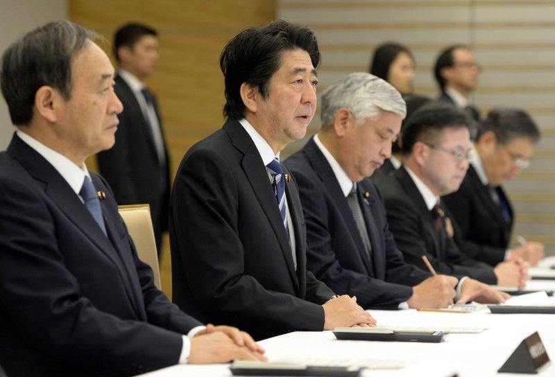 Emergency meeting: Japanese Prime Minister Shinzo Abe, second left, speaks during an emergency Cabinet meeting at the prime minister's official residence in Tokyo Sunday, after an online video released Saturday night purported to show an Islamic State group militant beheading Japanese journalist Kenji Goto.
