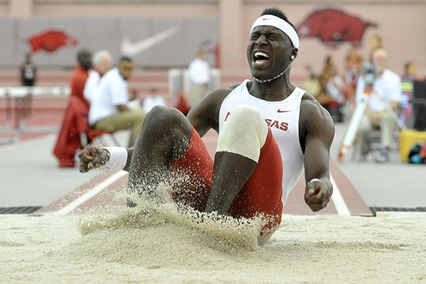 Arkansas triple jumper Clive Pullen lands during the triple jump finals Saturday, Jan. 31, 2015 at the Randal Tyson Track Complex in Fayetteville. Pullen finished second with a jump of 15.69m.