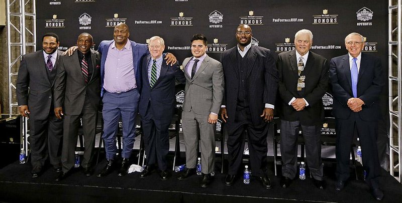 Members of the NFL Pro Football Hall of Fame class of 2015 are introduced Saturday, Jan. 31, 2015, in Tempe, Ariz. From left are running back Jerome Bettis; wide receiver Tim Brown; defensive end and linebacker Charles Haley; Bill Polian; Tyler Seau, son of the late linebacker Junior Seau, on behalf of his father; guard Will Shields; center Mick Tingelhoff; and Ron Wolf. 