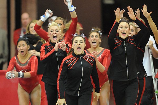 Arkansas athletes celebrate during the vault portion of the Razorbacks' meet with Alabama Friday, Jan. 16, 2015, in Barnhill Arena in Fayetteville.