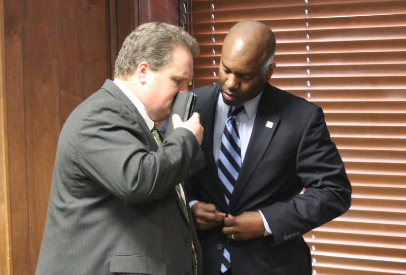 Rep. Nate Bell, R-Mena, confers with Rep. Fredrick J. Love , D-Little Rock, after speaking to the Arkansas Legislative Black Caucus Monday.

