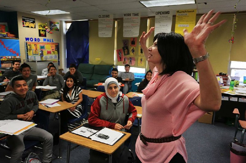 Arkansas Democrat-Gazette/RICK MCFARLAND  --- 02/02/15--  Lily Eskelsen GarcÌa, president of the National Education Association, talks with Hall High School students during a tour of the school in Little Rock Monday. The students were in Beatriz Varela's English ESL class level 1.