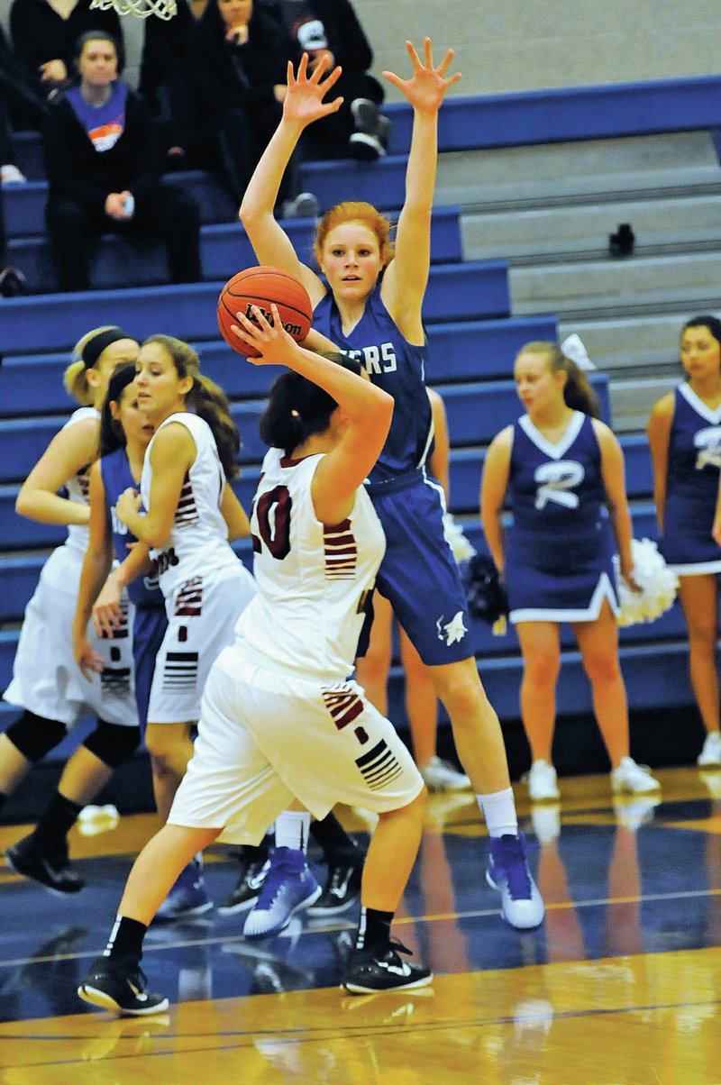 FILE PHOTO Elise Randels of Rogers High defends Dec. 6 during the Great 8 Classic in Rogers.