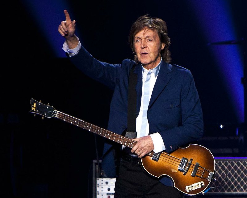 In this Oct. 15, 2014 file photo, former Beatle Sir Paul McCartney performs in concert as part of his Out There tour at Philips Arena in Atlanta.