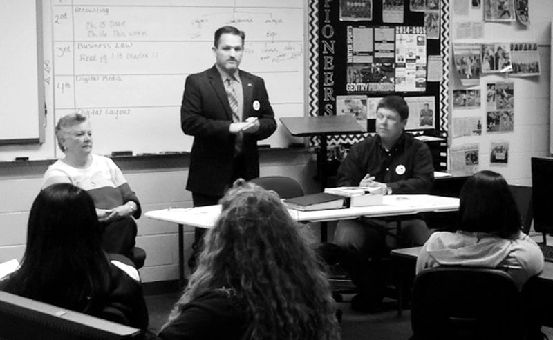 Submitted Photo Gentry&#8217;s mayor, Kevin Johnston (center), and city council members Janice Arnold and Jason Barrett, spoke to the business law class at Gentry High School on Jan. 20 to explain how city government passes ordinances and establishes city law.