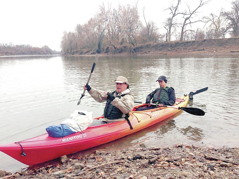 Photo by Cristina Coeme Michael Williams, of Gravette, and Henri Coeme, of Neosho, Mo., have formed a team and entered the Missouri 340, the world&#8217;s longest river race. They are pictured here in their kayak at Chetopa, Kan., just before starting a recent 39.68 mile training run on the Neosho River. They will be making several more training runs before the actual race July 28 - 31.