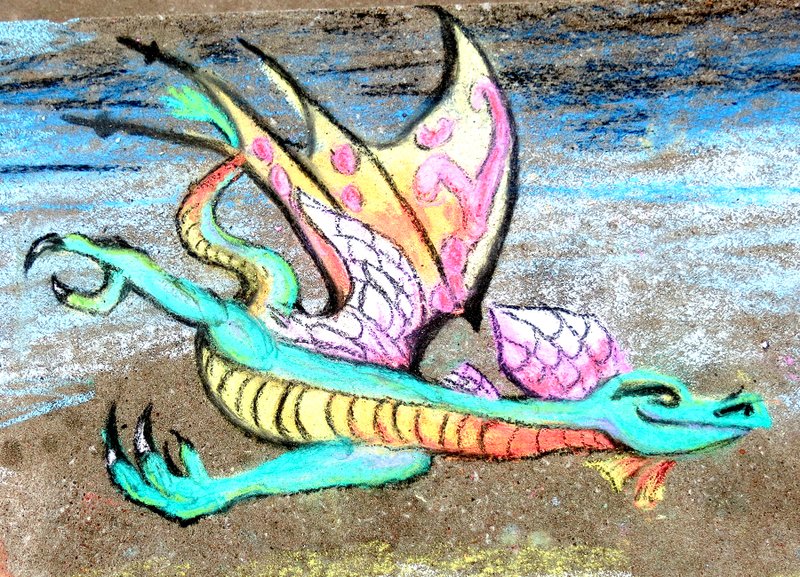 Photo by Mike Eckels A dragon flies across a picnic table at Crystal Lake Jan. 28 during a brief warm spell. The artwork is the latest installment of sidewalk art by Mike Kelly of Gravette, who took advantage of the nice weather to apply his talent.