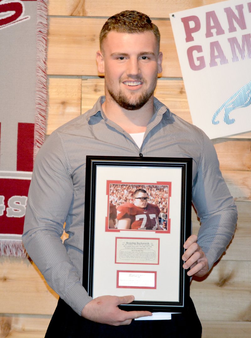 Graham Thomas/Herald-Leader Siloam Springs senior tight end/linebacker David Goodman was the recipient of the 2014 Brandon Burlsworth Award for the Siloam Springs football team. The award, which is given to a senior for every football-playing high school in the state, honors the late Burlsworth, a former walk-on lineman for the Arkansas Razorbacks who went on to become an All-American and get drafted in 1999 by the Indianapolis Colts of the National Football League. Eleven days after being drafted, Burlsworth was tragically killed in a car accident.