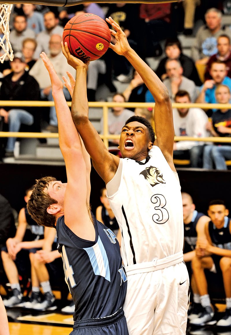  NWA Democrat-Gazette/ANDY SHUPE Jordan Hemphill (3) of Bentonville shoots over Mason McNee of Springdale Har-Ber during Tuesday&#8217;s game at Tiger Arena in Bentonville.