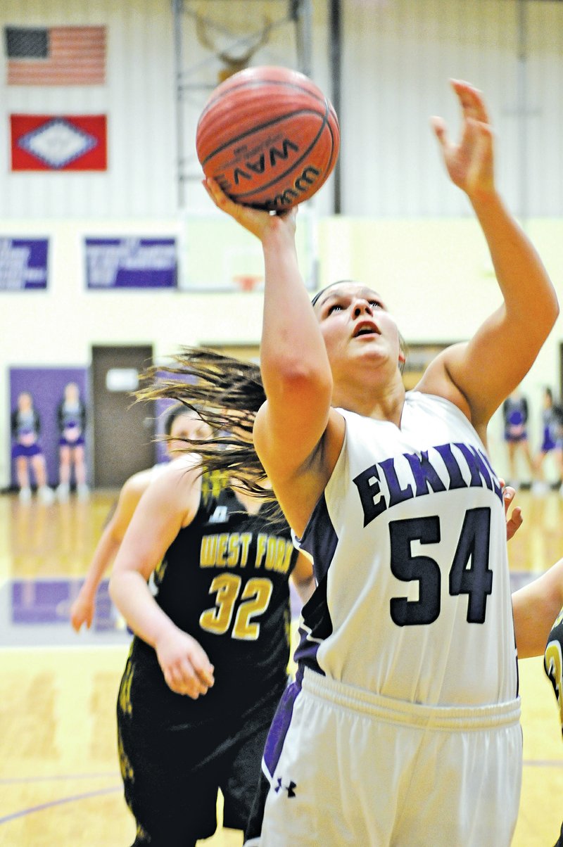  NWA Democrat-Gazette/ J.T. WAMPLER Mariah Hendrix of Elkins takes a shot Tuesday against West Fork. Elkins won 50-43 in three overtimes.