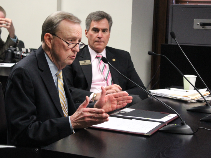 UALR Chancellor Joel Anderson speaks against a guns-on-campus bill while its sponsor, Rep. Charlie Collins, R-Fayetteville, looks on Thursday.