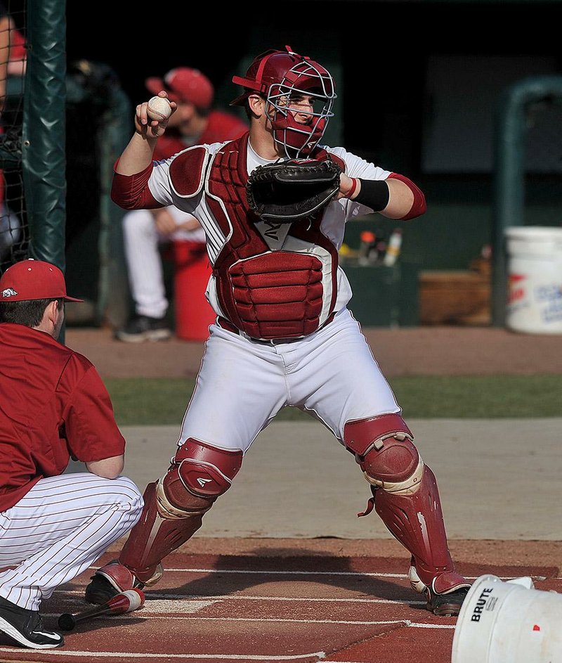 NWA Democrat-Gazette/Michael Woods --01/28/2015--w@NWAMICHAELW... University of Arkansas catcher Alex Gosser practices his footwork Wednesday afternoon at Baum Stadium during practice in Fayetteville.