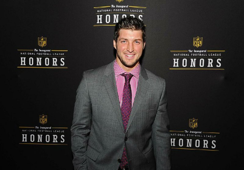 Denver Broncos Tim Tebow is seen backstage during the inaugural NFL Honors show Saturday, Feb. 4, 2012, in Indianapolis. (AP Photo/Newman Lowrance)