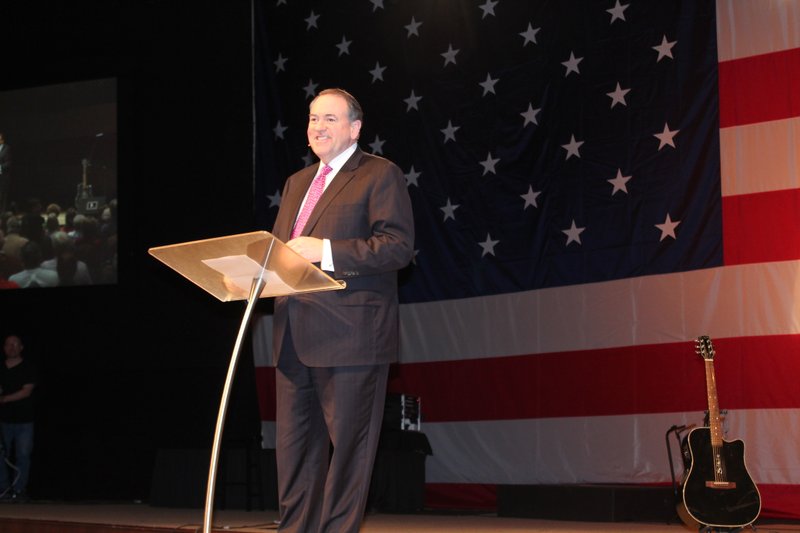Former governor Mike Huckabee speaks at an event Sunday to promote his new book, God, Guns, Grits and Gravy.