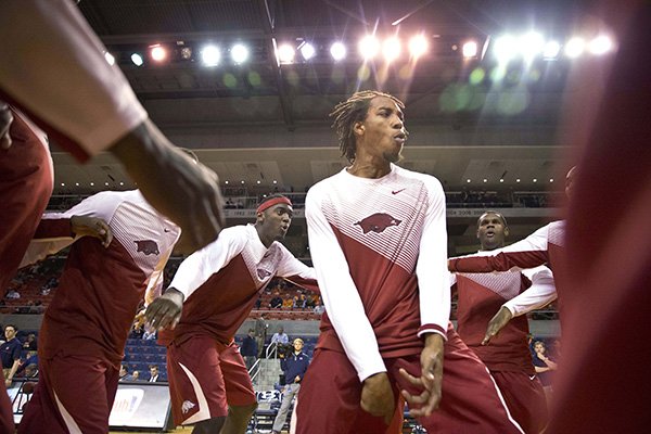 Arkansas guard Michael Qualls (24) pumps up his teammates before they take on Auburn in an NCAA college basketball game, Tuesday, Feb. 10, 2015, in Auburn, Ala. (AP Photo/Brynn Anderson)