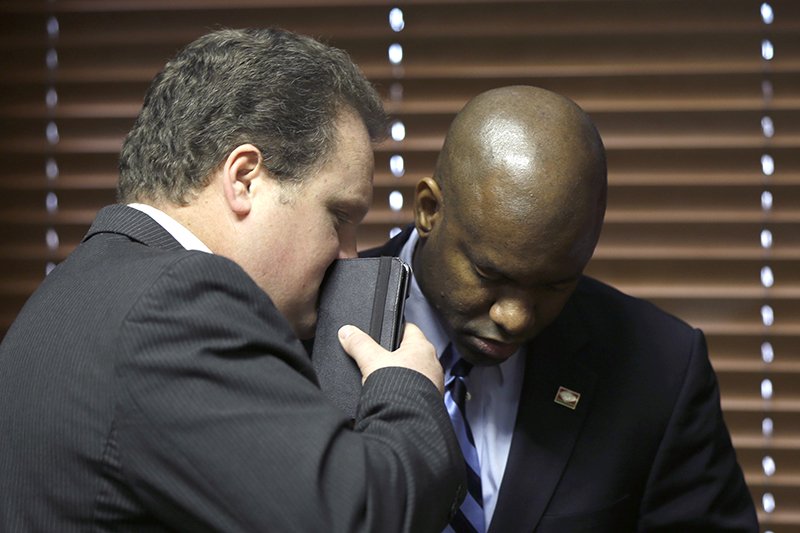 Rep. Nate Bell, R-Mena (left) speaks with Rep. Fredrick J. Love, D-Little Rock, during a meeting of the Arkansas Legislative Black Caucus, Monday, Feb. 2 in Little Rock, Ark. The representatives are sponsoring similar bills dealing with the birthday celebrations of Rev. Martin Luther King Jr. and Confederate Gen. Robert E. Lee.