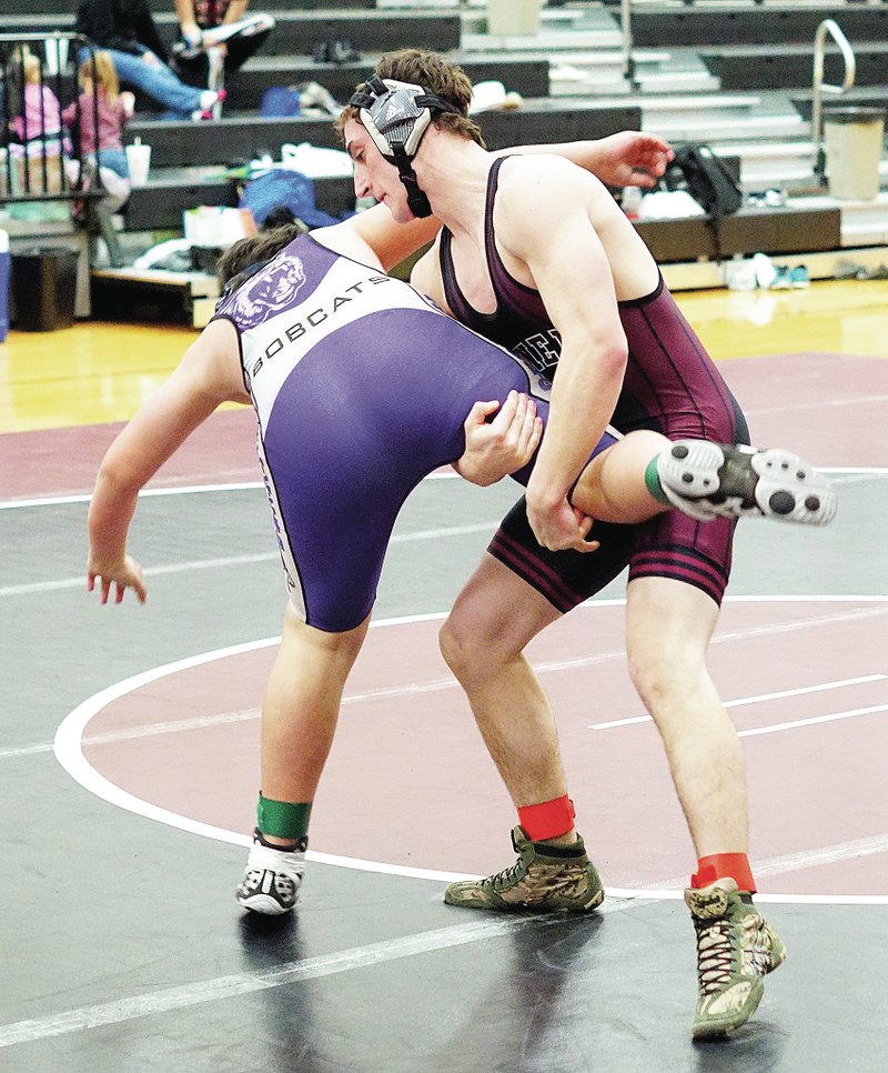 Photo by Randy Moll Cody Watson, senior wrestler for Gentry, takes down his Berryville opponent during a match between the two wrestling teams in Gentry on Feb. 3. Watson went on to pin his opponent. Though the Gentry team lost the match, senior wrestlers Watson and Zach Ellis defeated their opponents by fall. More wrestling photos are available on the eagleobserver.com website under the More Photos link at the bottom of the page.