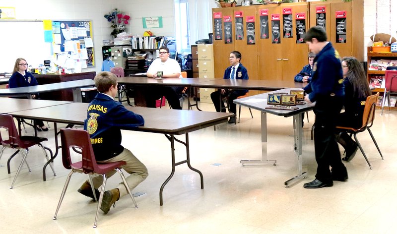 Photo by Mike Eckels A group of Siloam Springs Future Farmers of America students gathered in a Decatur classroom in preparation for their opening and closing ceremony presentations during the Ozark Federation Leadership contest Jan. 27 at Decatur High School.
