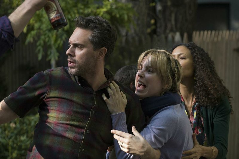 Outraged parents (Thomas Sadoski, Melissa George) react to their child being disciplined on NBC’s adult The Slap.