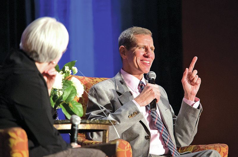 NWA Democrat-Gazette/JASON IVESTER Don Bacigalupi, (right) former president of Crystal Bridges Museum of American Art, is interviewed Thursday by Sandy Edwards, deputy director of the museum, during the annual Bentonville/Bella Vista Chamber of Commerce dinner at the John Q Hammons Center in Rogers.