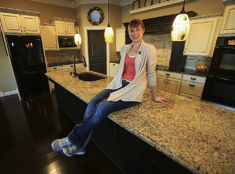 Kelli Marks, owner of Sweet Love Bakery, in her favorite space in her Little Rock home.