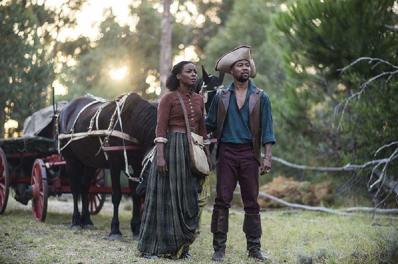 Aunjanue Ellis and Cuba Gooding Jr. star in BET’s fi rst miniseries, The Book of Negroes.