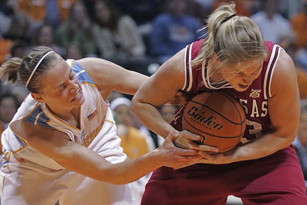 Tennessee's Angie Bjorklund, left, battles for the ball with Arkansas' Sarah Pfeifer during the second half of a basketball game Thursday, Jan. 24, 2008, in Knoxville, Tenn. (AP Photo/Wade Payne)