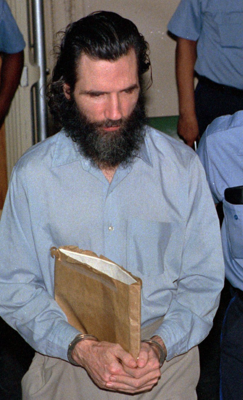 -In this file photo from June 29, 1988 murder-kidnap-rape suspect Gary Heidnik, is escorted from a holding cell. Heidnik, executed by lethal injection on July 6, 1999, was the last person to have the death penalty enforced upon in Pennsylvania. Newly elected Pennsylvania Gov. Tom Wolf imposed a moratorium on the death penalty in the state on Friday Feb. 13, 2015, calling the current system of capital punishment "error-prone, expensive and anything but infallible." 