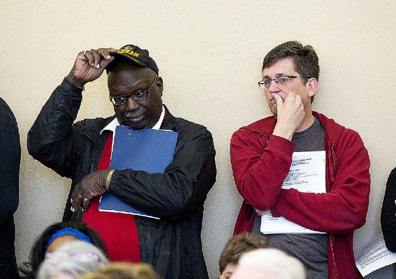 Former Little Rock School Board members C.E. McAdoo (left) and Jim Ross attend a community meeting Saturday about the state takeover of the Little Rock district. 