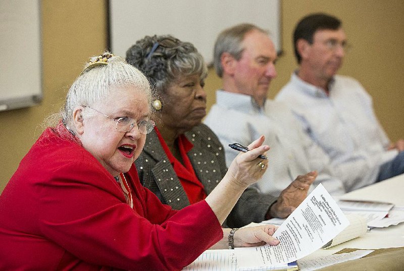 Kathy Wells (left), the current president of the Coalition of Little Rock Neighborhoods, is shown in this file photo seated beside Annie Abrams, Tony Wood and Sam Ledbetter. 