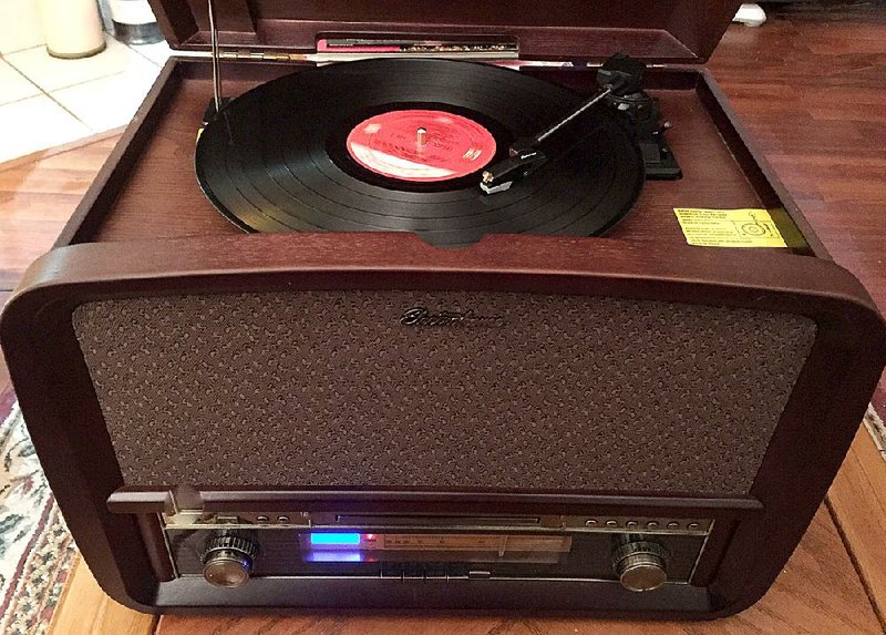 Special to the Arkansas Democrat-Gazette - 02/13/2015  - The Electrohome Signature Music System combines modern technology with a retro look and feel. It includes a turntable, CD player, AM/FM radio and a USB port for MP3 playing and recording.